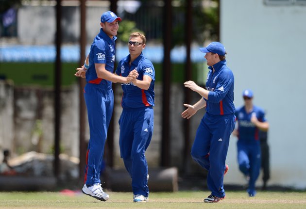 Danny Briggs of England celebrates with Stuart Broad after dismissing Mohammad Hafeez of Pakistan during the ICC T20 World Cup Warm Up Match