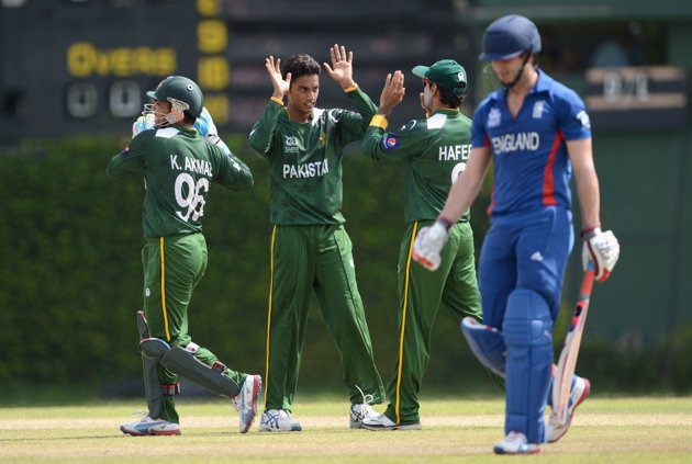 Raza Hasan of Pakistan celebrates with teammates after dismissing Craig Kieswetter of England